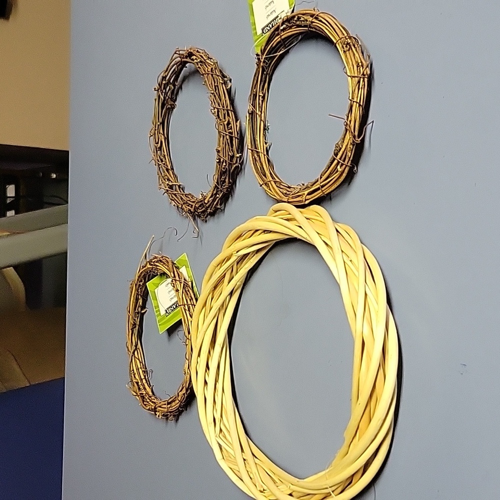 Four craft wreaths. One medium size and three small sizes.
